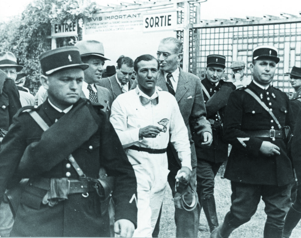 H.P. Mueller 1939: The Auto Union racing car driver is led to th